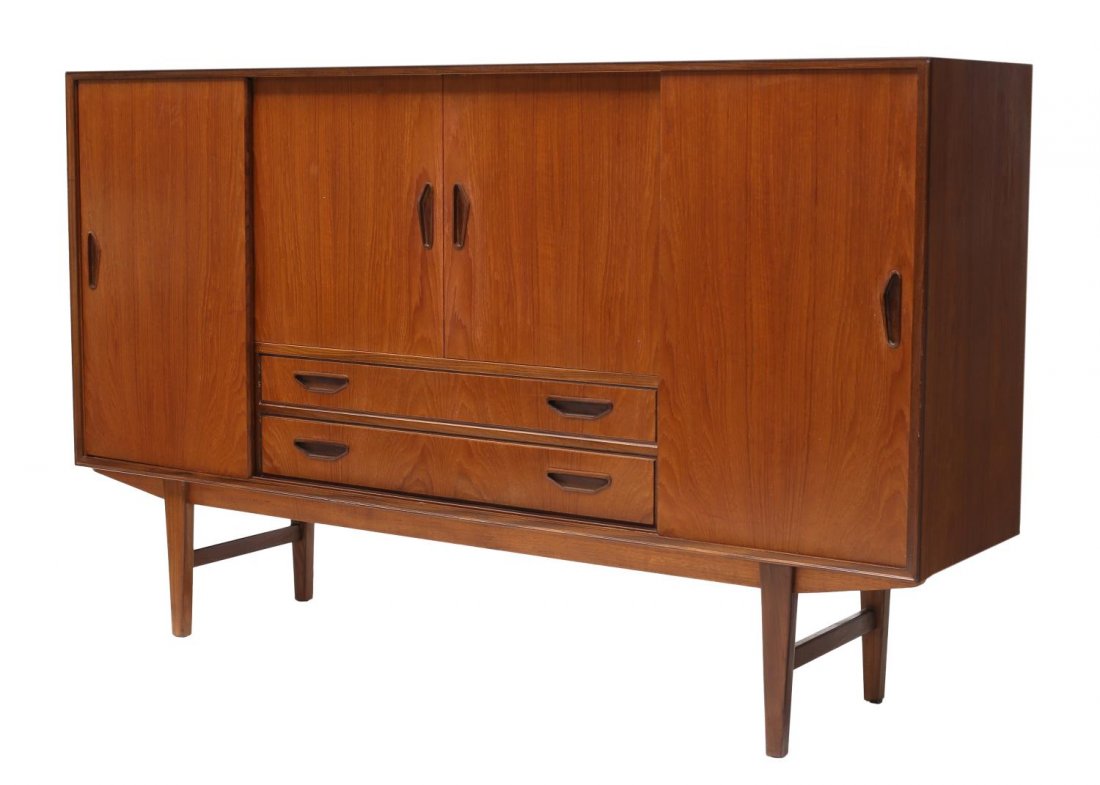 DANISH MID-CENTURY MODERN TEAKWOOD SIDEBOARD: Danish mid-century modern teakwood sideboard, 1950s/1960s, the rectangular case having central sliding doors opening to mirrored bar with shelf, over four short drawers and two long drawers, all flank