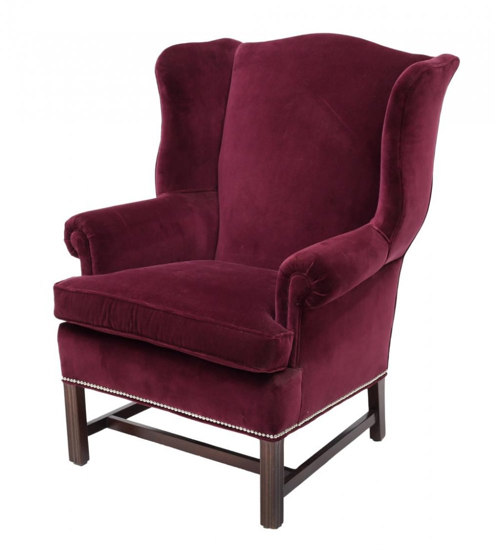 HANCOCK & MOORE PURPLE WINGBACK ARMCHAIR: Hancock and Moore wingback armchair, the shaped crest over the padded back and armrests, removable seat cushion, rising on grooved legs with joined support, in later purple upholstery, retaining tag, 