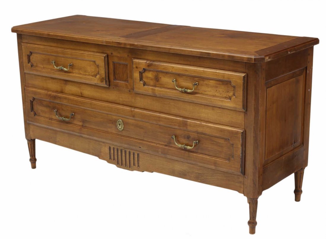 FRENCH CARVED FRUITWOOD PANTALONIERE COMMODE: French fruitwood pantaloniere or commode, 20th c., having two short drawers over a long drawer, raised on tapered ribbed supports with blunt arrow feet, 28"h, 53.5"w, 18.25"d Start Price: $200.00