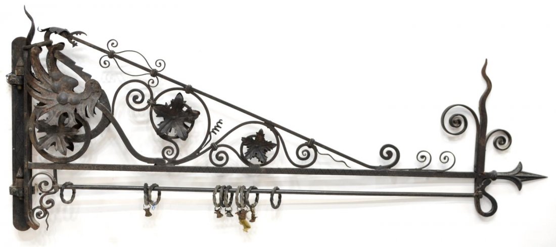 STUDIO LUIGI COPPEDE IRON CURTAIN HOLDER: Iron curtain holder, Studio of Luigi Coppede, Italian, 20th c., decorated with pierced scrolling foliates, 65"l, 28"w Start Price: $300.00