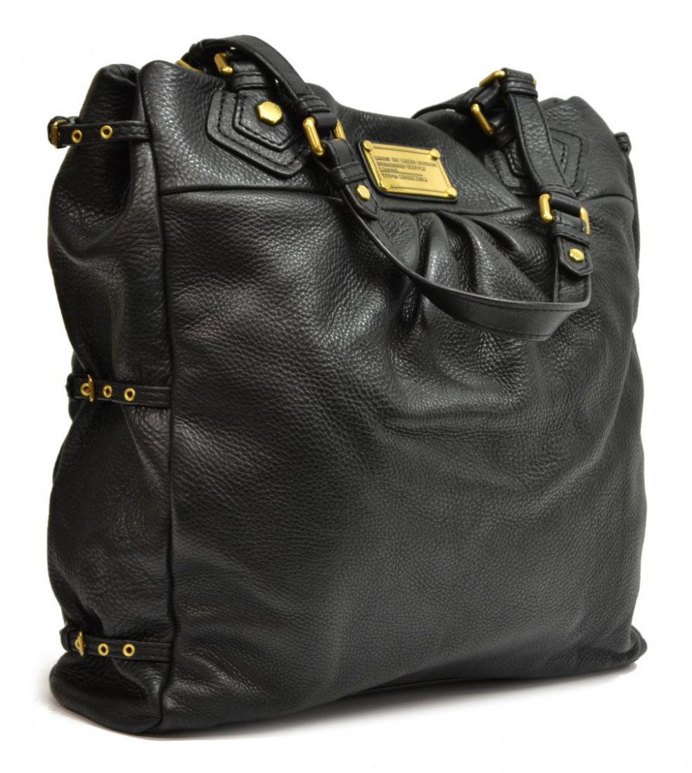 MARC BY MARC JACOBS BLACK GRAINED LEATHER TOTE BAG: Marc by Marc Jacobs shopping tote bag in black grained leather, having duel handles, gold tone hardware, the magnetic closure top opening to monogram patterned fabric interior, with zipper pocket, slo