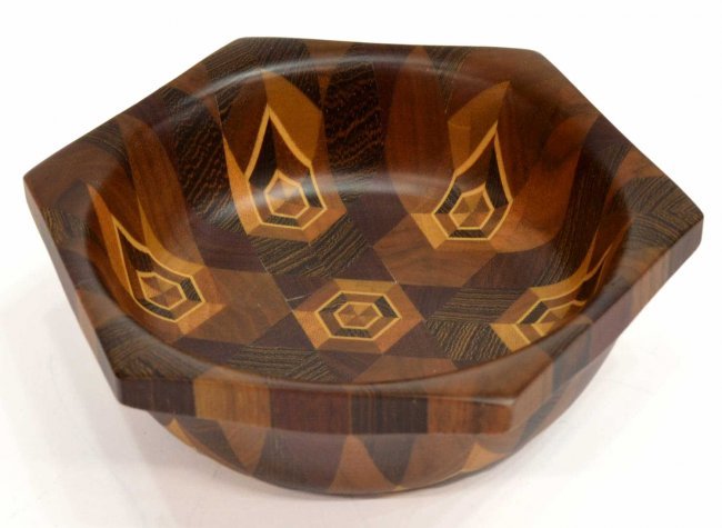 (2) INLAID MIXED WOOD BOWL & BRASS EGG CARL AUBOCK: (lot of 2) Decorative items: (1) Mixed wood bowl, inlaid with geometric patterns throughout, flared rim, initialed underfoot as pictured, 2"h, 6"w, .75lb; (1) Diminutive brass paperweight in the form
