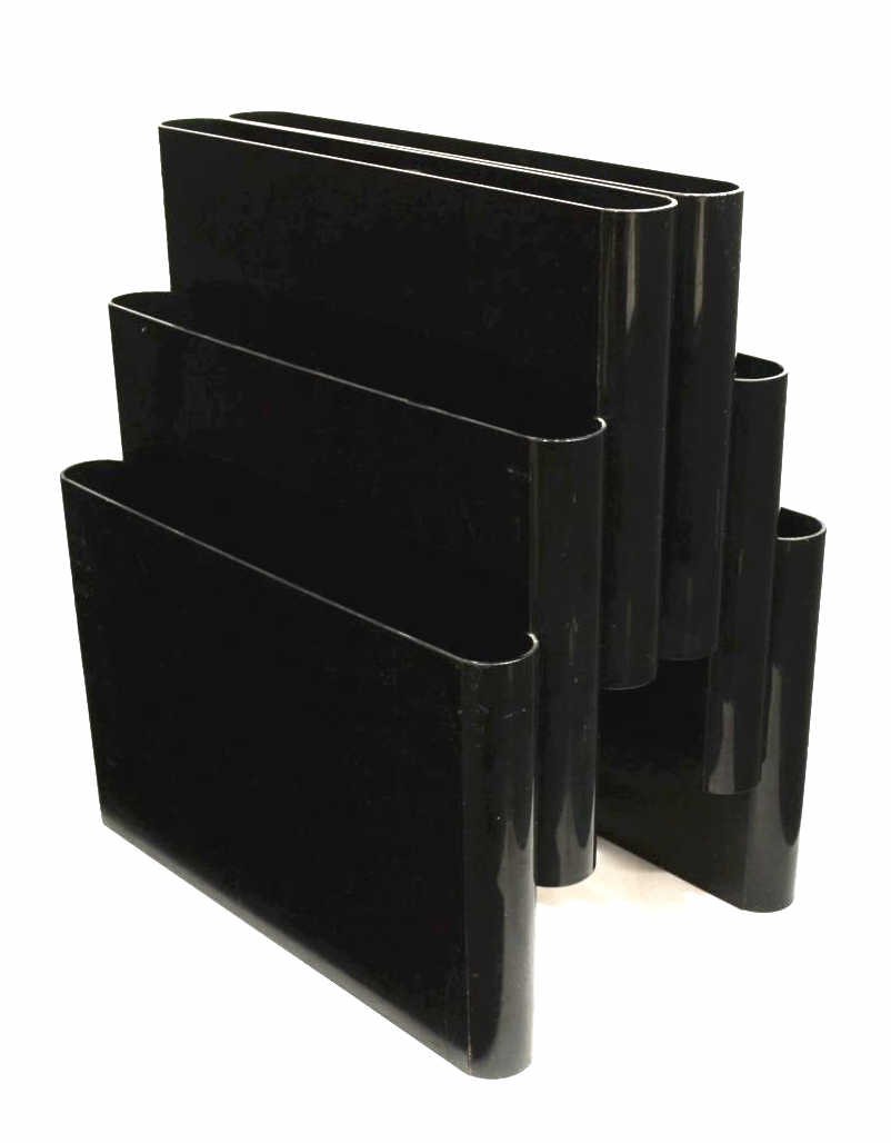 KARTELL ITALIAN MODERN PLASTIC MAGAZINE RACK: Italian modern magazine holder by Kartell, c.1970, in black plastic with six slots, surface wear, approx 17"h, 11"l, 15.75"w, 7.75lbs Start Price: $60.00
