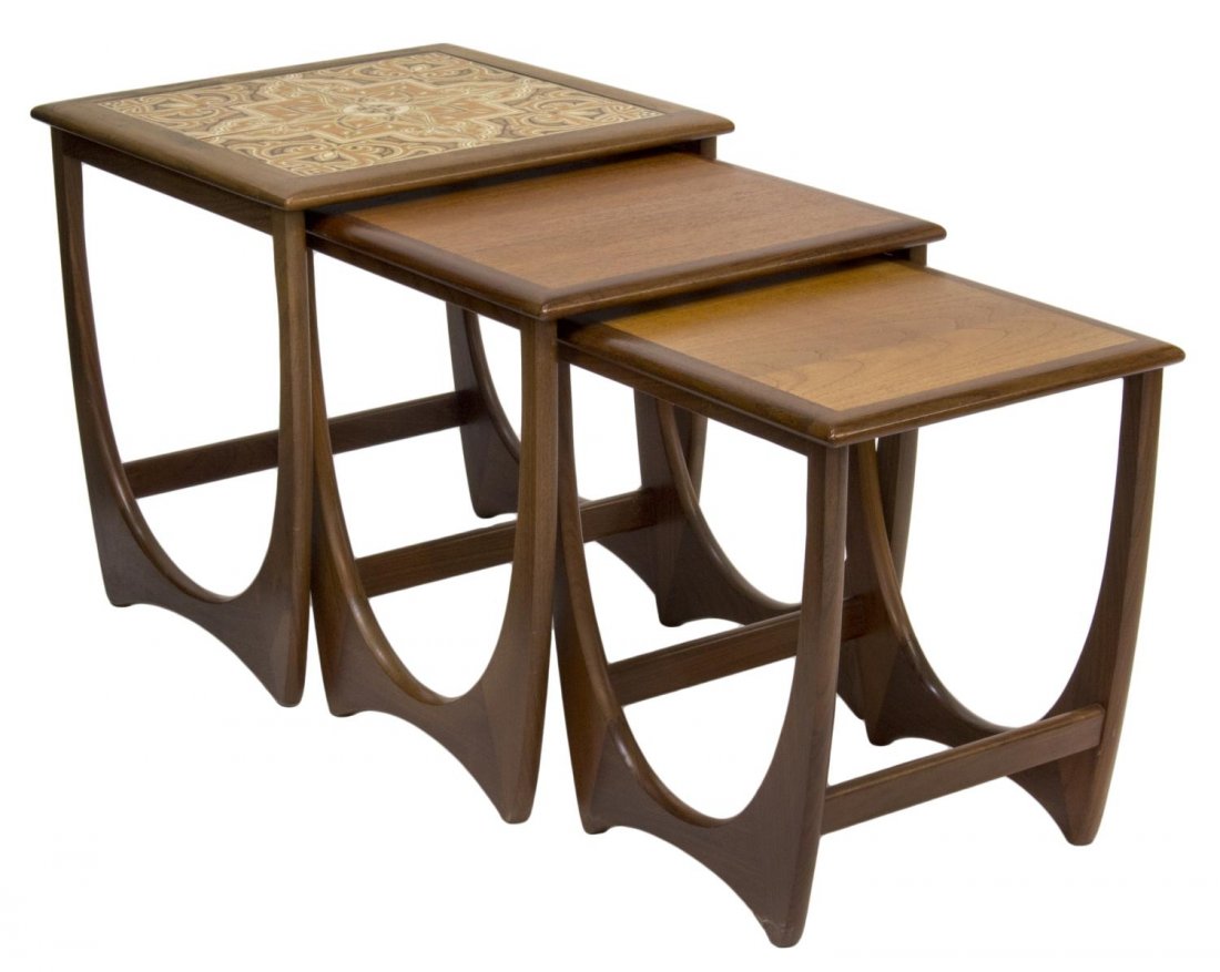 MID-CENTURY MODERN TEAKWOOD NESTING TABLES 1960: Mid-Century modern teakwood nesting tables, c. 1960, the largest having four arabesque glazed tiles fitted to top, all rising on tapered legs with joined support, largest: 20"h, 19.5"w, 19.5"d, smalle