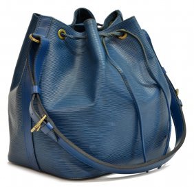 LOUIS VUITTON 'NOE PM' EPI LEATHER BUCKET BAG: Louis Vuitton "Noe PM" drawstring bucket bag in blue Toledo Epi leather, having an adjustable shoulder strap, gold tone hardware, drawstring top opens to blue fabric lined interior, wear to cord and b