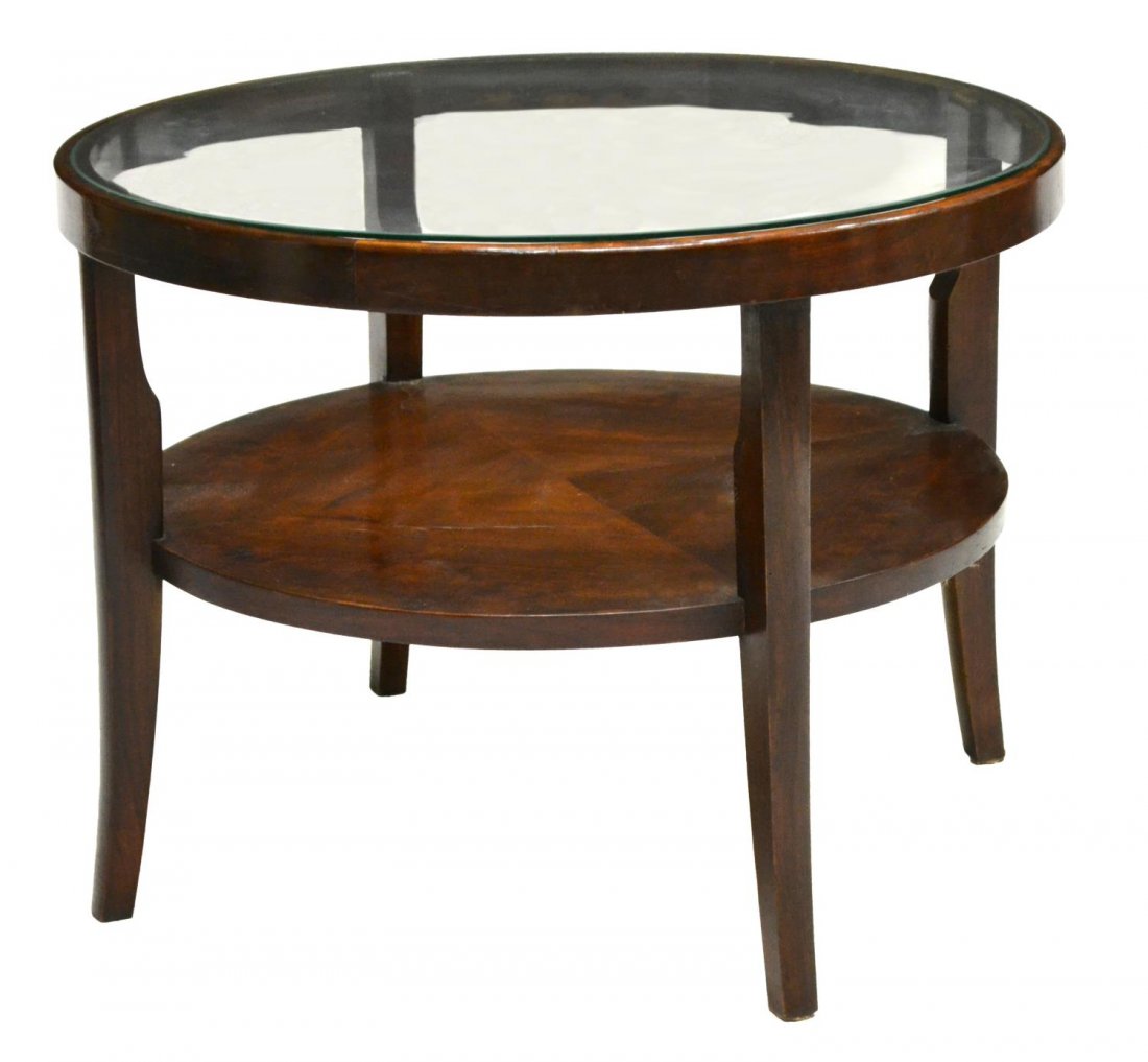 ITALIAN ART DECO GLASS TOP COFFEE TABLE C. 1930S: Italian Art Deco coffee table, c. 1930s, the glass top above a shelf, rising on flared tapered legs, 20"h, 26.5" diam. Start Price: $60.00
