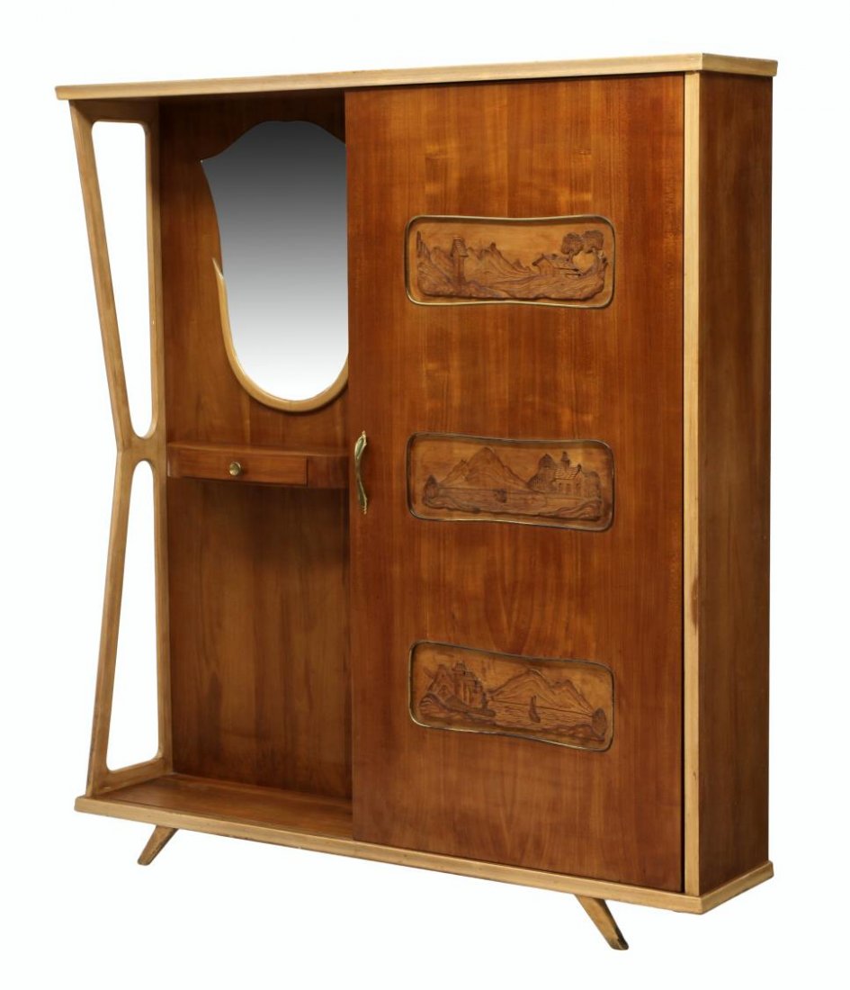 ITALIAN MID-CENTURY MODERN ENTRY COAT CABINET: Italian mid-century modern entry cabinet, 1950's, one side with a sliding door coat closet with carved landscape panels, the other side mirrored with a shelf and drawers, rising on angular legs, 70.25