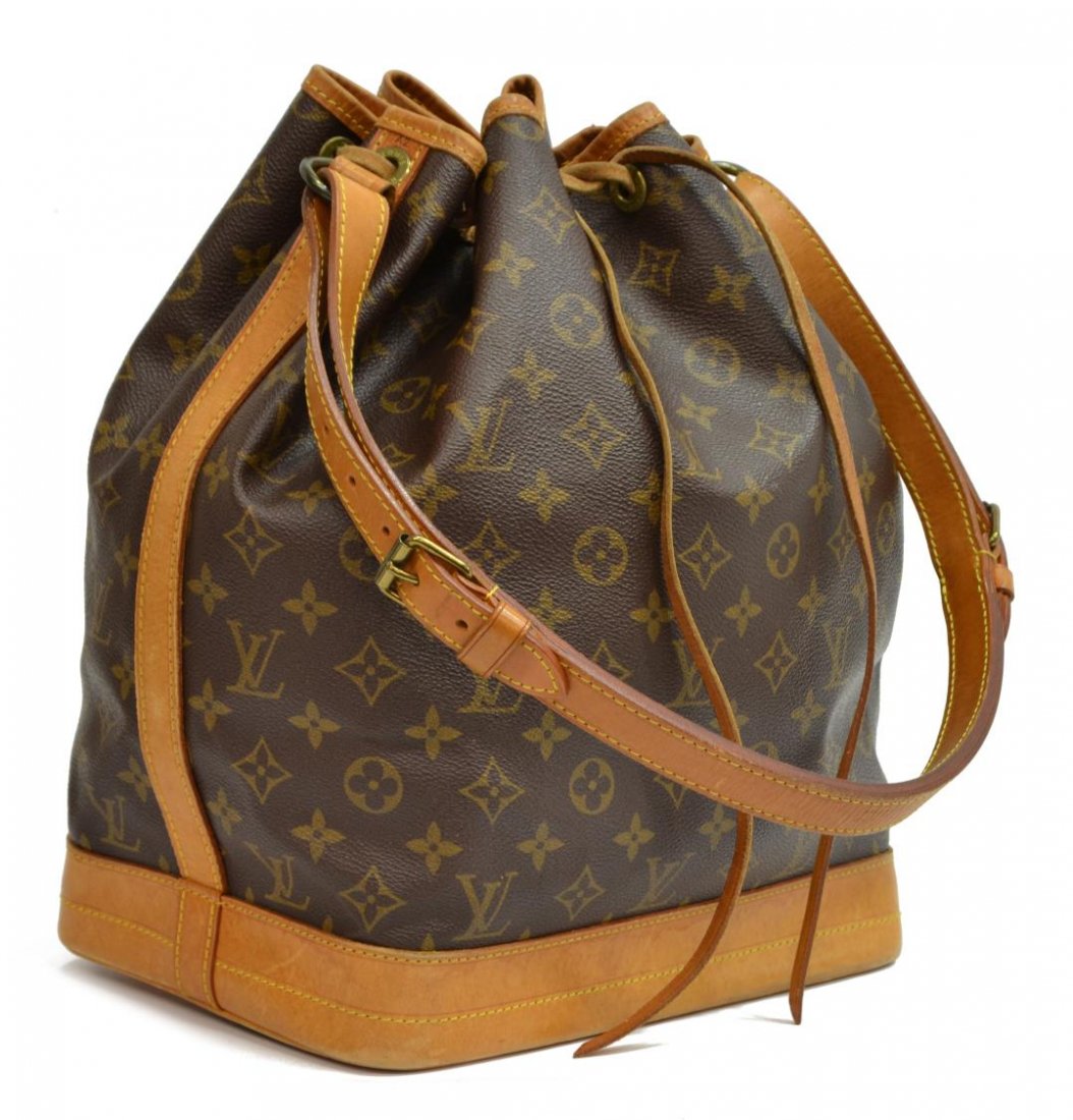 LOUIS VUITTON 'NOE GM' MONOGRAM CANVAS BUCKET BAG: Louis Vuitton "Noe" drawstring bucket bag in monogram canvas, leather adjustable shoulder strap and trim, gold tone hardware, the drawstring top opening to brown fabric lined interior, patination and 