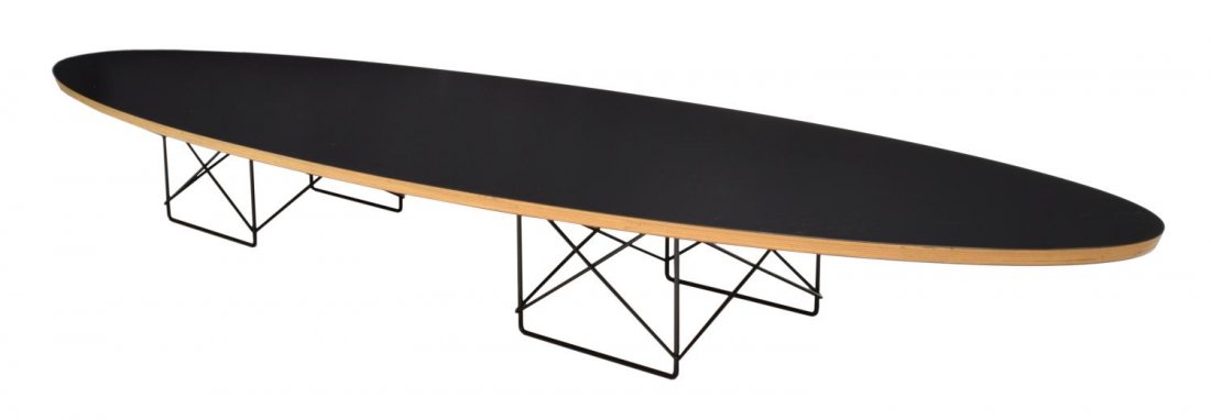 EAMES FOR HERMAN MILLER ELLIPTICAL COFFEE TABLE: Mid-century modern "Surfboard" coffee table, design by Charles and Ray Eames for Herman Miller, an ovoid form, the black laminate top rising on wire 'cage' rod supports, Eames Herman Miller tag at und