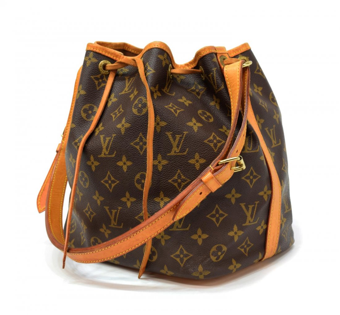 LOUIS VUITTON 'NOE PM' MONOGRAM CANVAS BUCKET BAG: Louis Vuitton "Noe PM" drawstring bucket bag in monogram canvas, leather adjustable shoulder strap and trim, gold tone hardware, the draw string top opening brown fabric lined interior, patination, sp