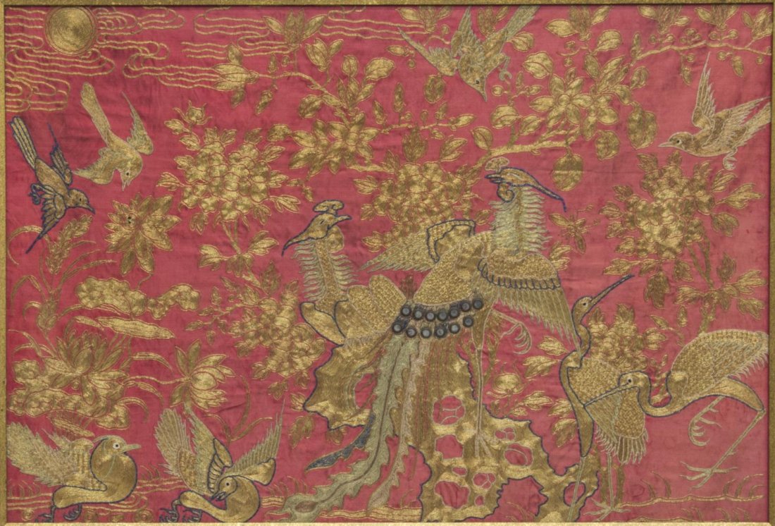 FRAMED CHINESE SILK EMBROIDERED PANEL: Framed Chinese silk embroidered panel, depicting birds and peacock in flight, metallic gold thread, couched on red silk ground, accented by mirrored disks, sight: 21.5"h, 31.25"w, overall: 24.5"h, 34.