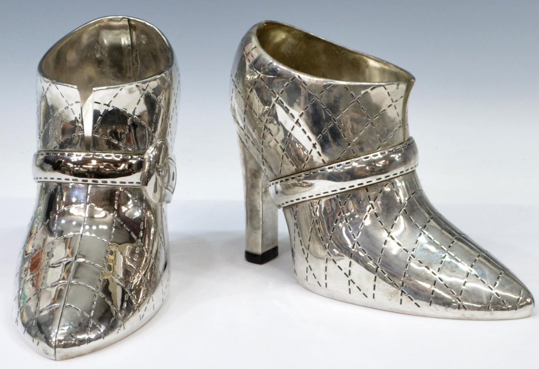 (2) GODINGER SILVERPLATE SHOE FORM WINE BOTTLE HOLDERS: (lot of 2) Godinger silver plate wine / champagne bottle holders, each in the form of a high heel shoe, 8"h, 8lbs total Start Price: $50.00