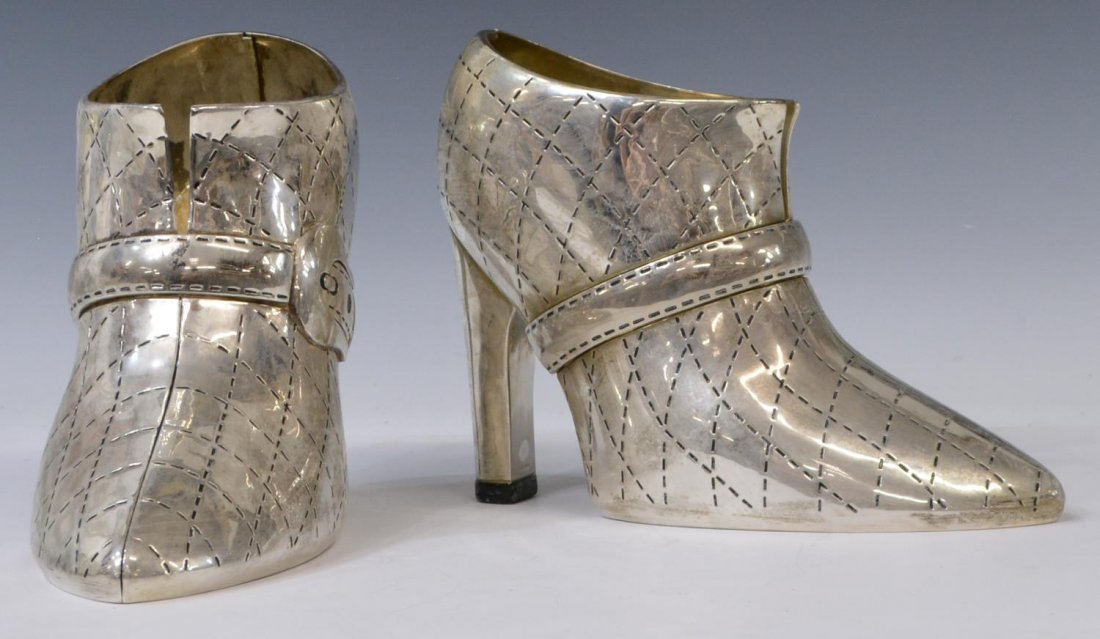 (2) GODINER SILVERPLATE SHOE FORM WINE BOTTLE HOLDERS: (lot of 2) Godinger silver plate wine / champagne bottle holders, each in the form of a high heel shoe, 8"h, 8lbs total Start Price: $50.00