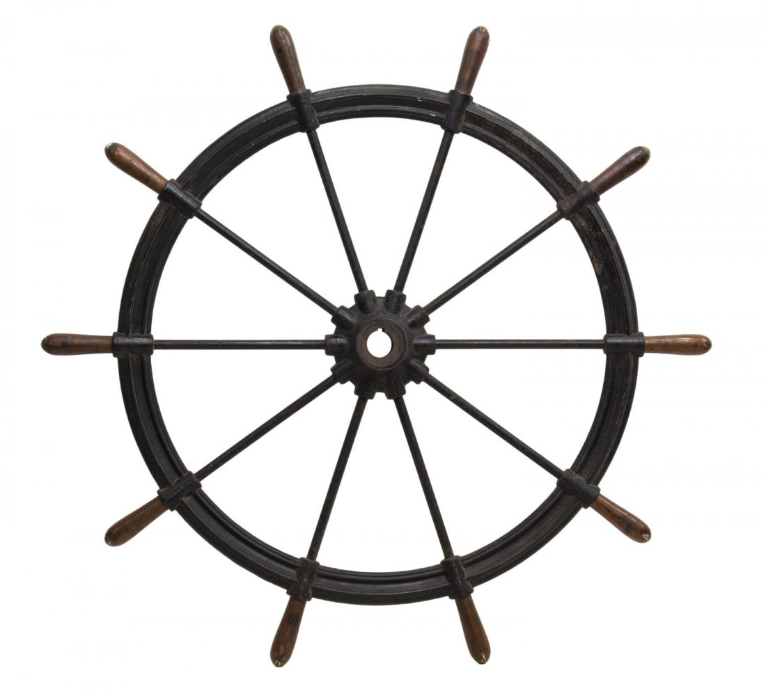 MONUMENTAL AMERICAN CAST IRON & WOOD SHIPS WHEEL: Monumental cast iron ships wheel, ten spokes, ending in wood handles with metal end caps, some oxidation, 59.5"diam Start Price: $250.00