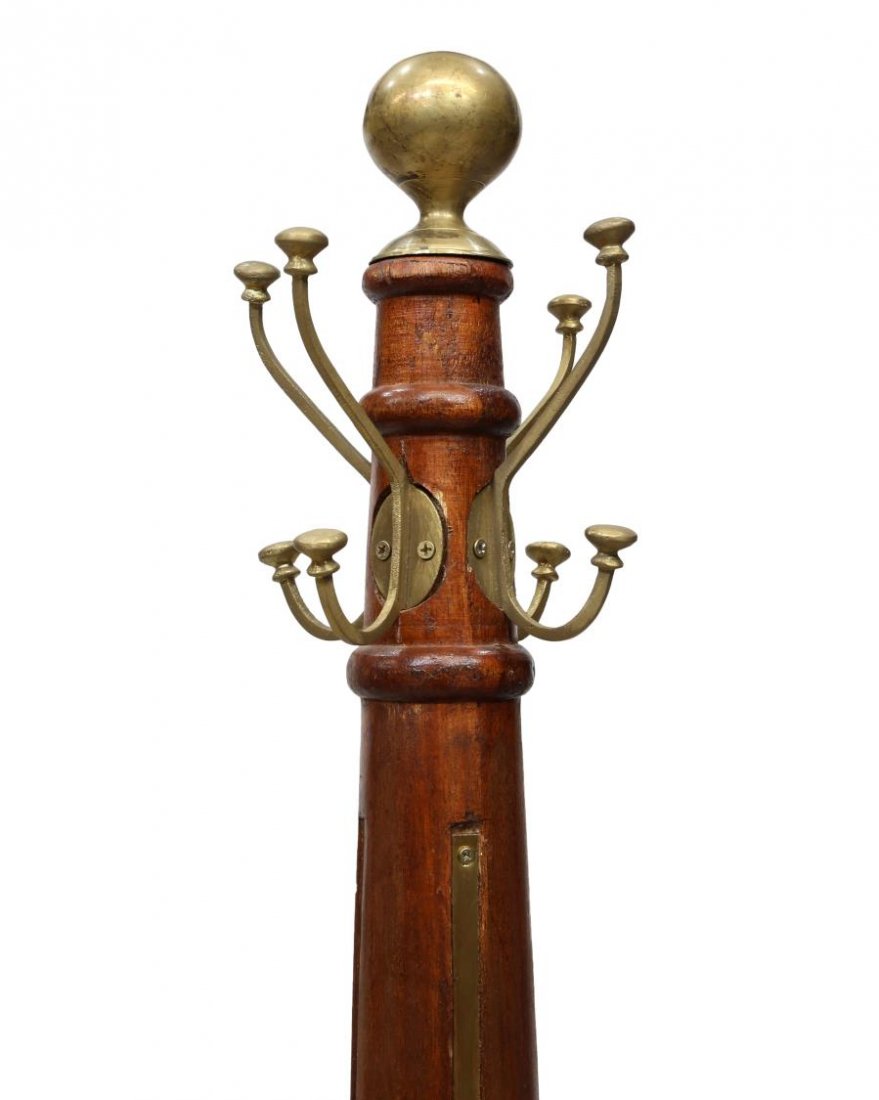 TALL TEAKWOOD & BRASS STANDING COAT/HAT RACK: Teakwood coat / hat stand, a brass ball and four hooks, surmount the cylindrical standard with inset brass straps, rising on four scrolled legs, approx 78.75"h Start Price: $150.00