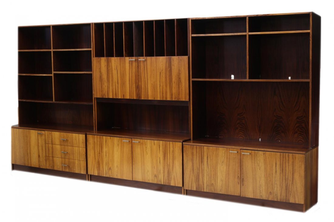 DANISH MID-CENTURY THREE SECTION ROSEWOOD BOOKCASE: Danish mid-century modern two tone rosewood three section bookcase, 1960s, fitted with open shelves, slots and doors, each section approx. 69"h, 47.25"w, 19"d Start Price: $400.00