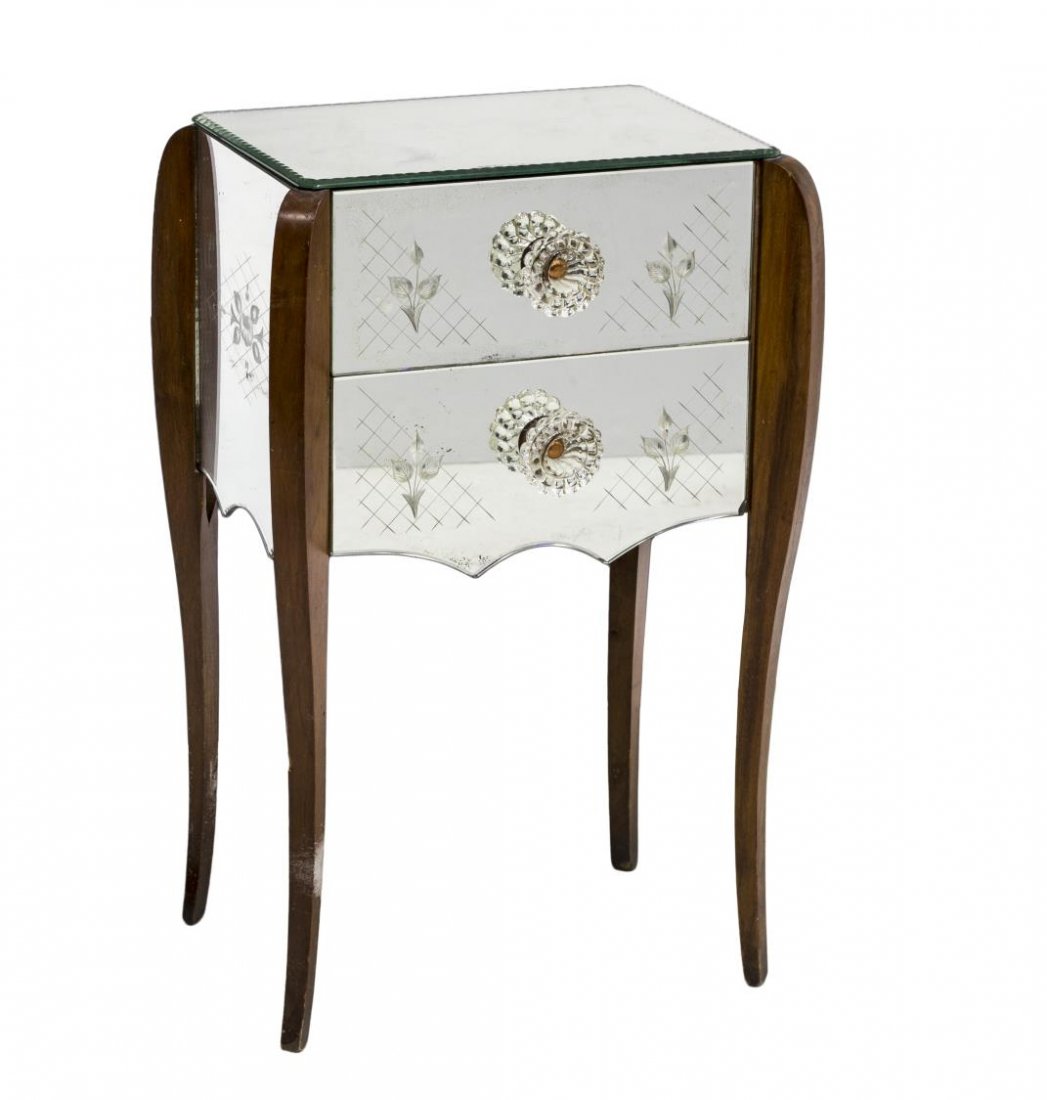 FRENCH CUT MIRRORED GLASS & WOOD SIDE TABLE: French mirrored glass side table, c. 1950's, the mirrored top having scalloped border, raised on four curved wood legs, two foliate accented mirrored drawers with large glass pulls, conforming mirrore