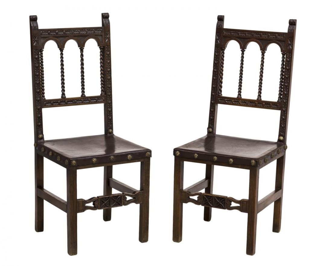 (2) SPANISH ARCADED SIDE CHAIRS: (lot of 2) Spanish side chairs, early 20th c., an open arcaded back with twist supports over the leather seat, rising on straight ribbed legs joined by a carved front stretcher, 41.25"h, 17"w, 17"d St