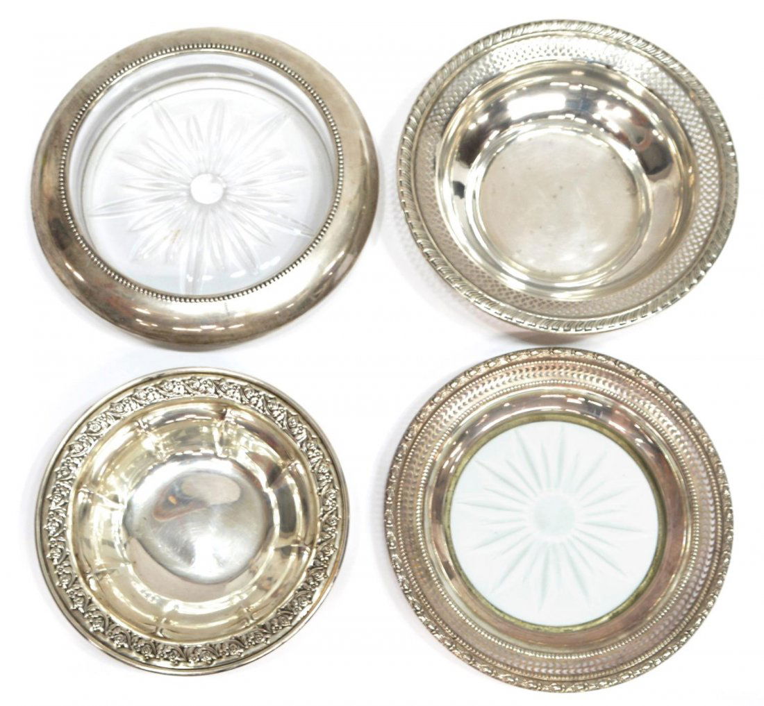 (4) GROUP OF STERLING SILVER & CUT GLASS TABLEWARE: (lot of 4) Sterling silver table items: (2) sterling rimmed and cut glass wine caddies / coasters, largest: 7"diam; (1) small Gorham bowl having floral and foliate border, 5.5"diam; (1) sterling bowl,