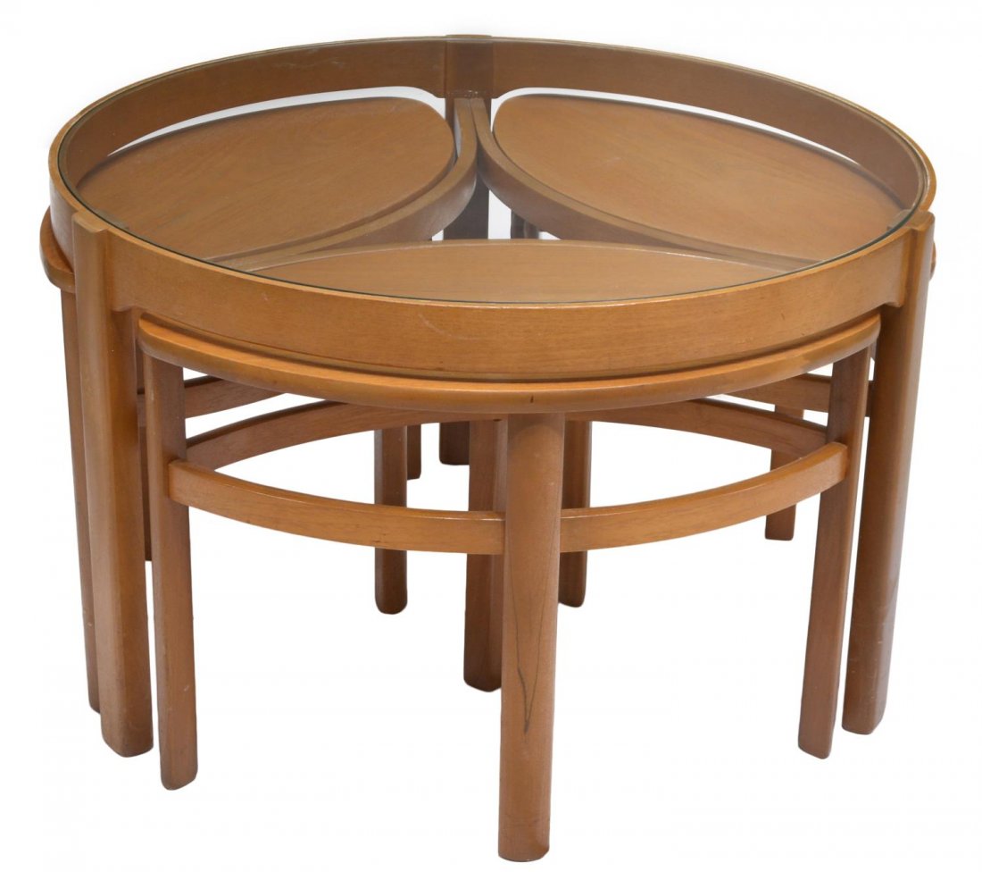 ENGLISH MID-CENTURY MODERN STYLE NESTING TABLES: English mid-century modern style Trinity nesting tables, 20th c., the inset glass circular top rising on three supports over three ovoid form nesting tables bearing the label of "Nathan Furniture", la