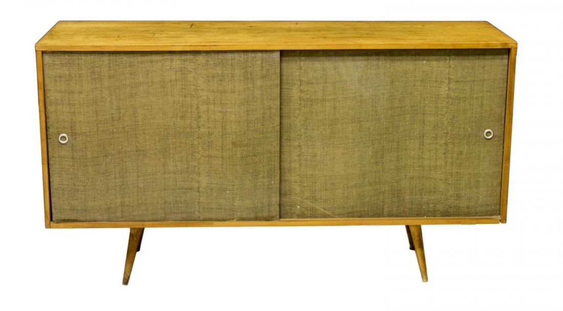 PAUL MCCOBB MID-CENTURY MODERN SIDEBOARD, 1960S: Mid-century modern sideboard, c. 1960s, design by Paul McCobb for Winchendon Planner Group, c. 1960, the blonde wood case fitted with two reed wrapped sliding doors concealing pull out drawers and she