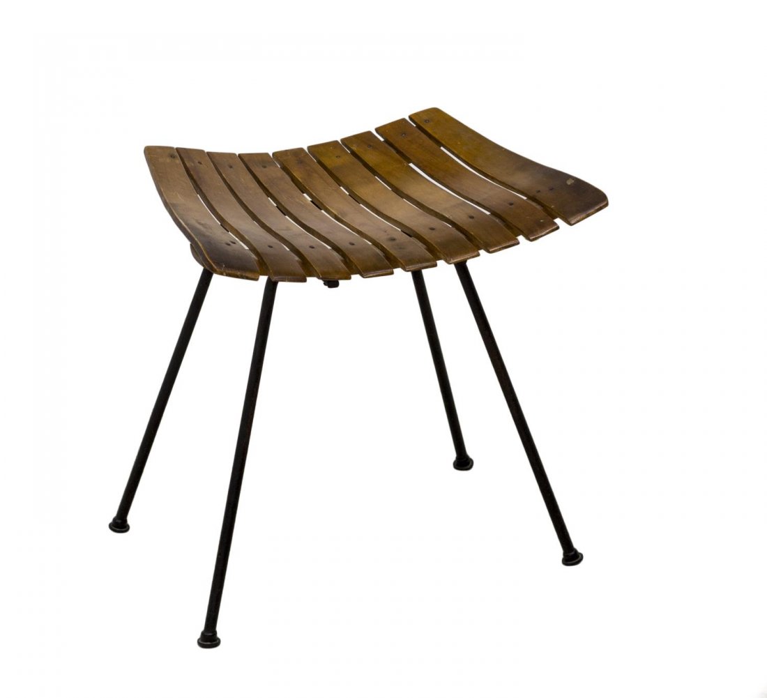 MID CENTURY MODERN ARTHUR UMANOFF VANITY STOOL: Mid-century modern vanity stool, design by Arthur Umanoff, c. 1960s, having a slat seat over wrought iron base, 18.5"h, 42.5"w, 14.25"d *Provenance: The estate of Ferris and Jeanette Nassour owners of