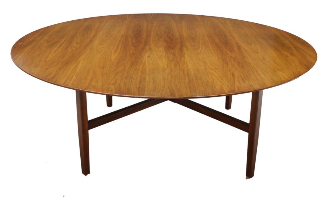 FLORENCE KNOLL CIRCULAR TOP WALNUT TABLE, 72"D: Circular top dining or conference table, design by Florence Knoll (b. 1917) for Knoll Furniture Co., rising on a square base with stretcher joined squared tapered legs, 28.5"h, 72" diameter