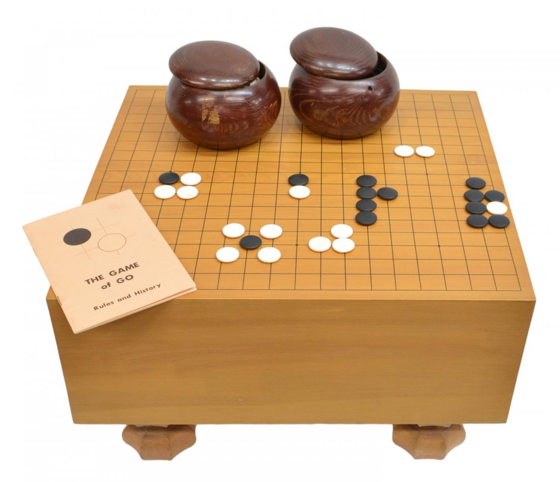 (3) VINTAGE CHINESE GO TABLE & STONES IN WOOD JARS: (lot of 3) Vintage Chinese Go table mounted on short octagonal supports with two lidded wood jars holding the black and white "stones", jars: 3.75"h, 5.25"diameter, table: 11.5"h, 17.75"w, 16.25"d, to