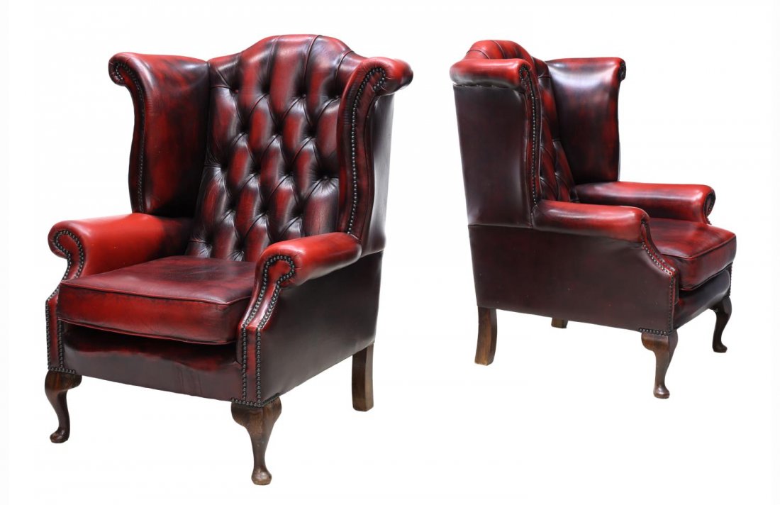 (2) ENGLISH QUEEN ANNE OXBLOOD LEATHER CLUB CHAIRS: (pair) English Queen Anne style oxblood leather wingback club chairs, c. 1970, each having a tufted back over scrolling armrests, removable cushion, and nailhead trim, rising on short cabriole legs, 4