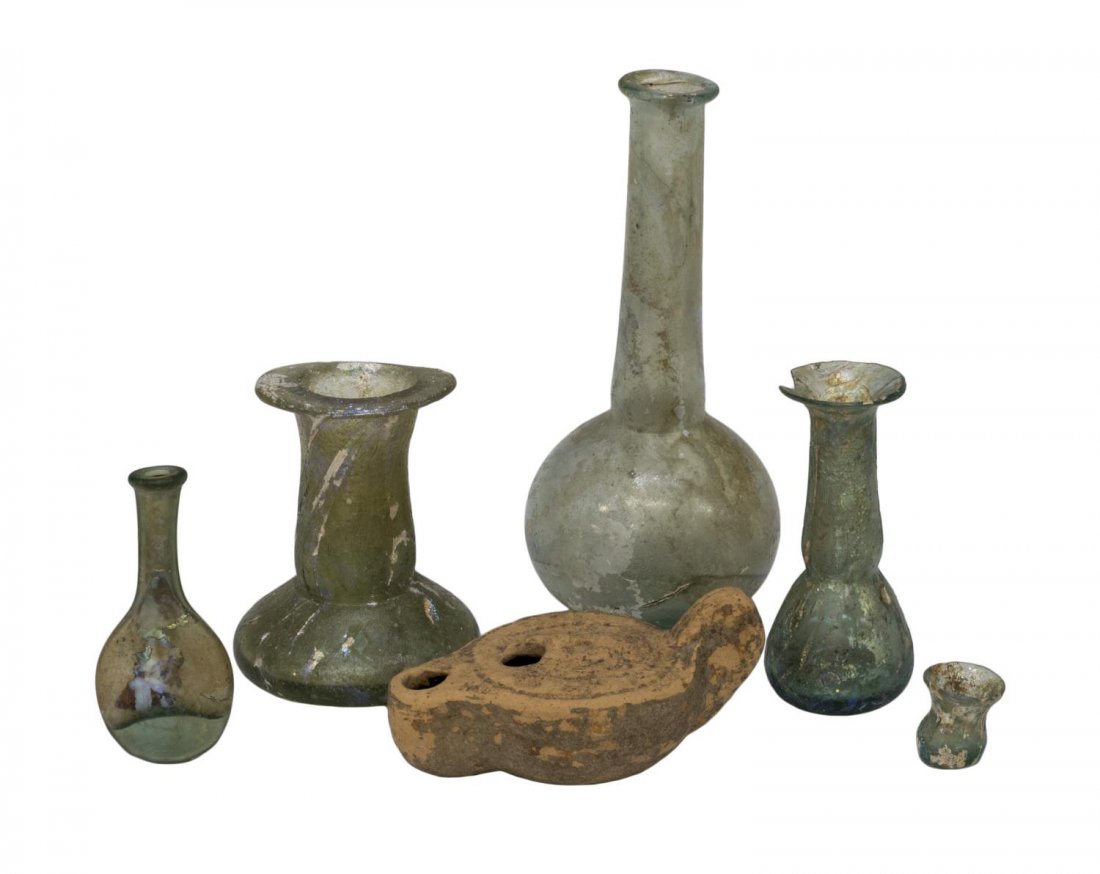 (6) ANCIENT ROMAN IRIDESCENT GLASS BOTTLES & LAMP: (lot of 6) Ancient Roman iridescent glass bottles, comprising: (1) long neck bottle, approx. 6"h; (1) bottle with flared rim over long neck and short body, 3"h; (1) delicate bottle with chipped rim, 3