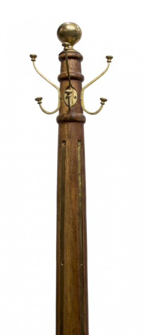 TALL TEAKWOOD & BRASS STANDING COAT/HAT RACK: Teak coat / hat stand, a brass ball and four hooks, surmount the cylindrical standard with inset brass straps, rising on four scrolled legs, approx 78.75"h Start Price: $150.00