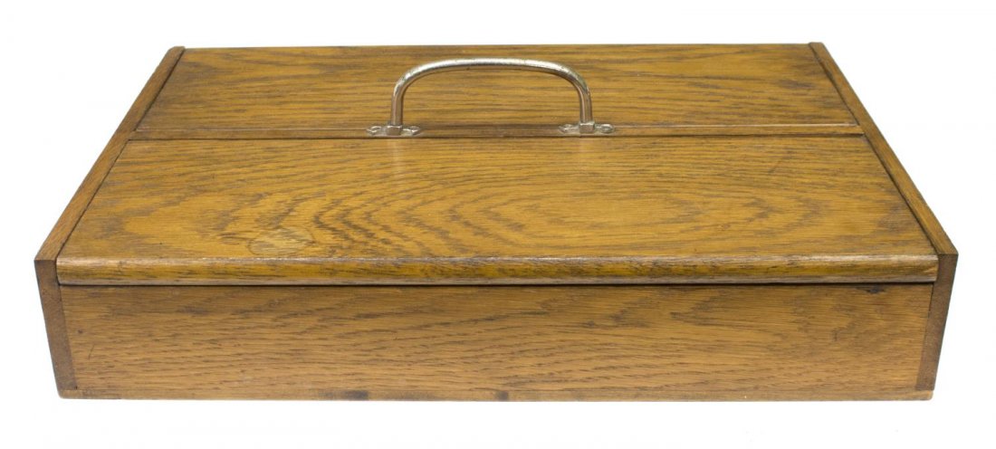 EDWARDIAN TWO DOOR OAK CUTLERY BOX: Edwardian two door cutlery box, early 20th c. having a chromed metal handle, 4.5"h, 15.5"w, 10.5"d, 3.75lbs Start Price: $40.00