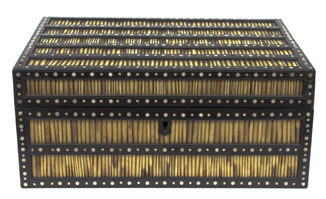 ANGLO-INDIAN INLAID PORCUPINE QUILL BOX: Anglo-Indian ebonized porcupine quill box of rectangular form, the hinged lid having wood strapping with inlaid bone dots, opening to reveal lift out storage, 5"h, 11.25"w, 8"d, 4.5lbs Start Price: $8