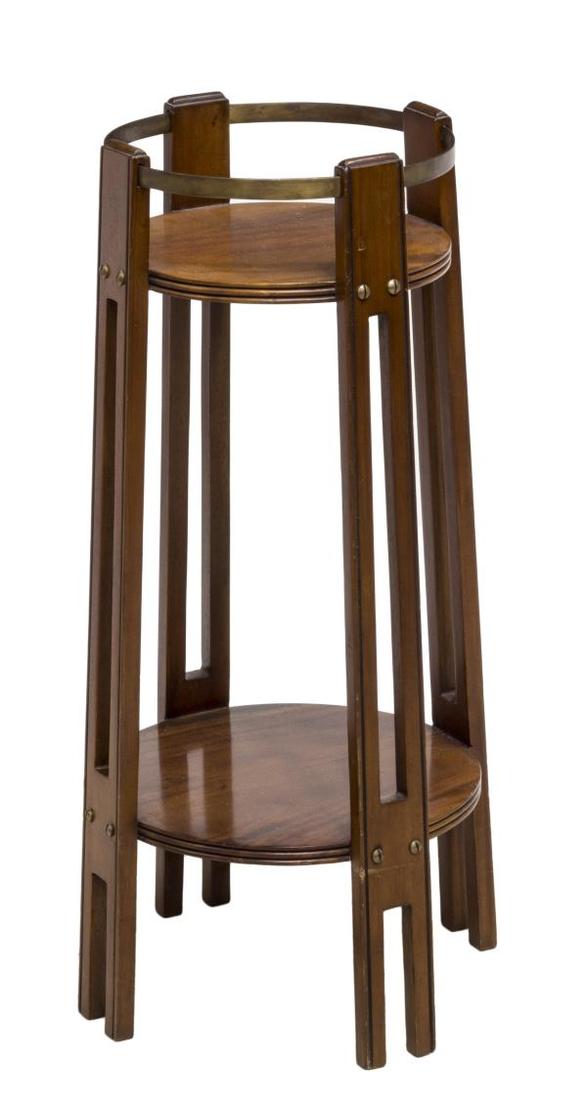 ENGLISH ARTS & CRAFTS MAHOGANY & BRASS PLANT STAND: English Arts and Crafts mahogany plant stand, having a brass gallery ring around the circular top, over a lower shelf, rising on inlaid feet, 31"h, 12" diam Start Price: $60.00
