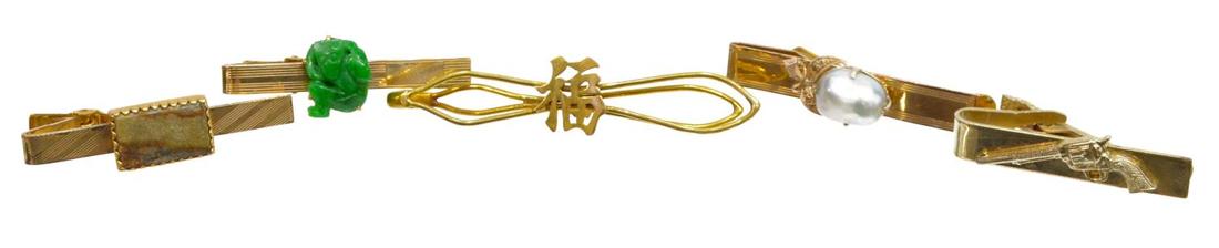 (5) GENTS 14K GOLD & PLATED TIE BARS JADE & PEARL: (lot of 5) Gents tie tacks, comprising: (1) 14kt yellow gold Chinese tie bar, 2.75"l, 6 grams; (4) gold plated tie tacks, including pearl, jade, agate, and gun, largest: 2"l, 31.4 grams (inclusive of