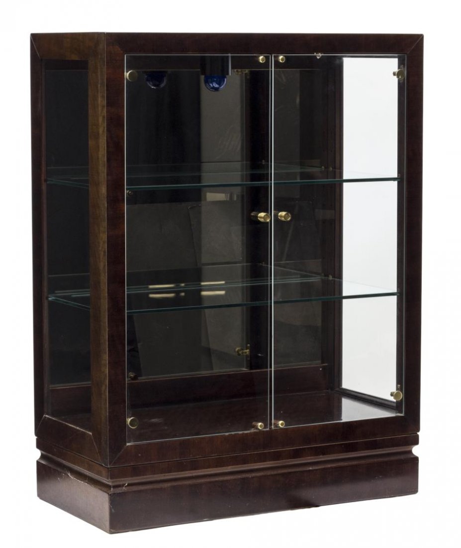 HENREDON LIGHTED DISPLAY CABINET: Henredon brown mahogany finish lighted display cabinet with two glass doors opening to adjustable height shelves, all raised on a plinth base, 48.25"h, 36.25"w, 18"d Start Price: $150.00