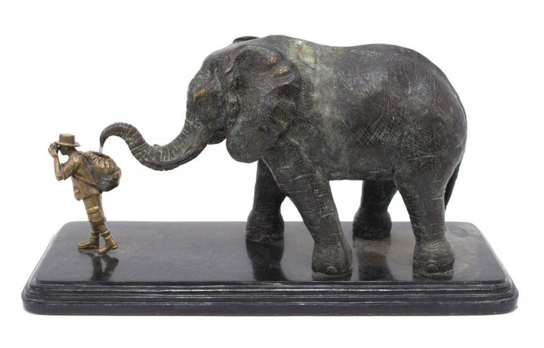 MAITLAND SMITH WHIMSICAL ELEPHANT STATUE: Maitland-Smith bronze patina cast brass table top statue, having a tourist with camera in front of an elephant, rising on stepped plinth base, 9.5"h, 18"w, 7"d, 13lbs Start Price: $80.00
