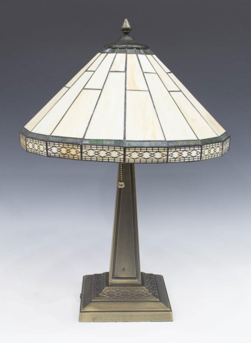 TIFFANY STYLE STAINED GLASS 2-LIGHT TABLE LAMP: Tiffany style stained glass two light table lamp, having a circular shade over the tapered standard, rising on square base, 24"h, 16" diam., 9.25lbs Start Price: $50.00