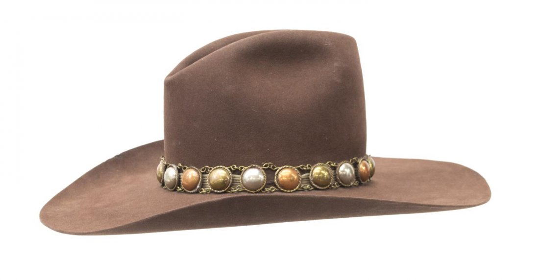 CUSTOM BROWN COWBOY HAT, O'FARRELL DURANGO CO: Custom cowboy hat, by O'Farrell, Durango, CO, having a 5'' brim, copper, brass, and silver tone band, inscribed "Custom made for Mel Schaeffer", wear, size 7.25, 1.25lbs Start Price: $40.00