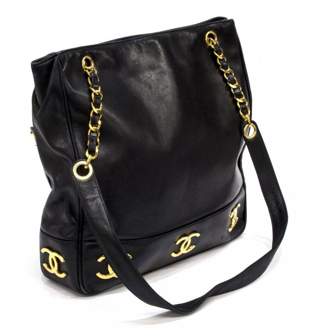 CHANEL BLACK CALF LEATHER DOUBLE STRAP TOTE BAG: Chanel shopper/tote shoulder bag in black calf leather, having gold tone hardware, a front slot pocket with interlocking CC logos across bottom and sides, double chain and leather straps over snap clo