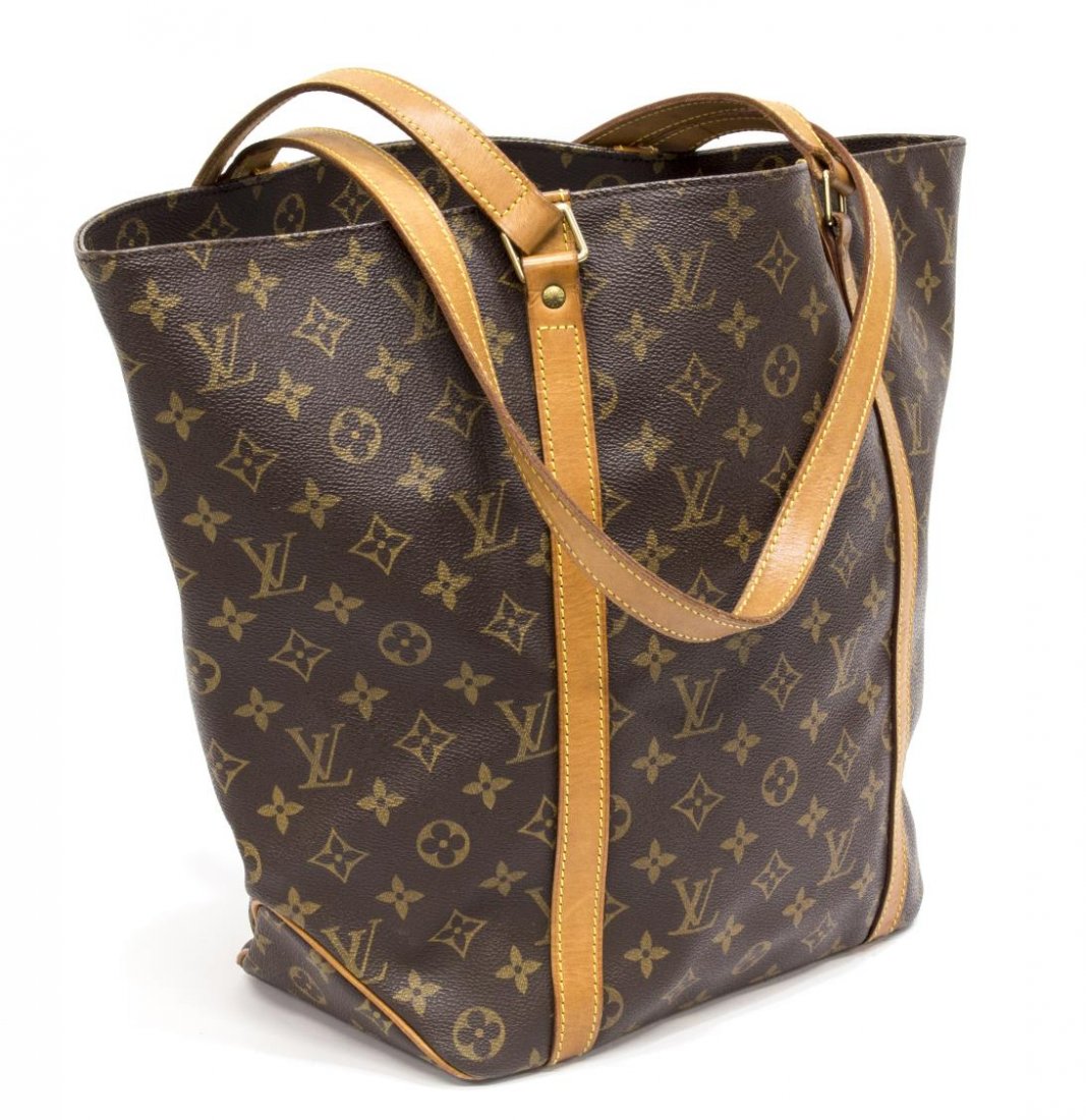 LOUIS VUITTON MONOGRAM 'SAC' SHOPPING TOTE BAG: Louis Vuitton monogram canvas "Sac" shopping tote, having leather handles and trim, top opening to canvas interior featuring single zip pocket and key tab, patination, creasing, and spotting to leathe