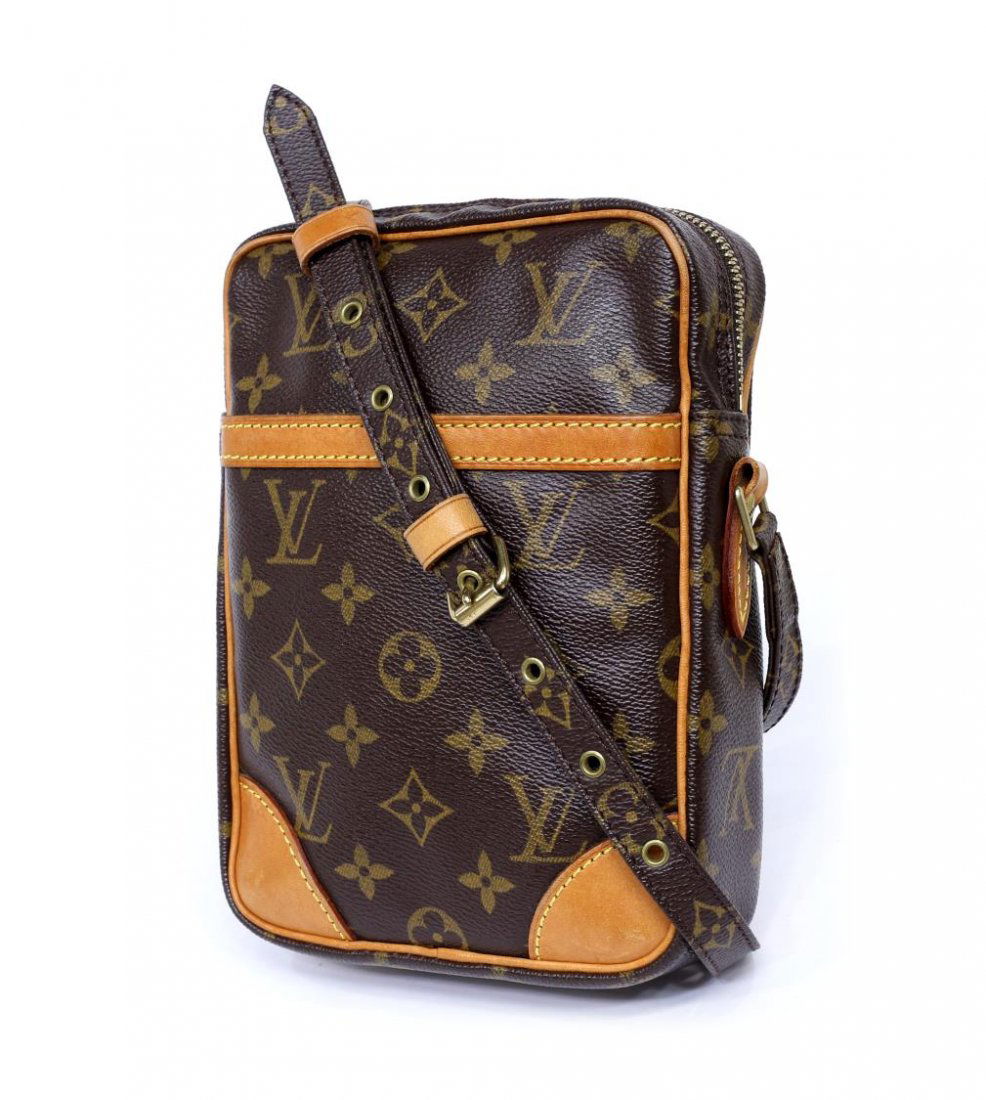 LOUIS VUITTON 'DANUBE' MONOGRAM SHOULDER BAG: Louis Vuitton "Danube" monogram canvas shoulder bag, exterior slip pocket, adjustable shoulder strap, gold tone hardware, top unzips to brown interior featuring a slot, patination and spotting to leat