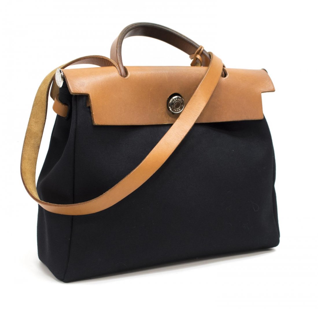 HERMES LEATHER & BLACK CANVAS HERBAG IN DUST BAG: Hermes black single "Herbag" with brown leather trim and strap, interior canvas hanging slot pocket, accompanied by dust bag, approx 11.5"h, 11"w, 4"d, 2.25lbs *Provenance: Luxury goods offered in par