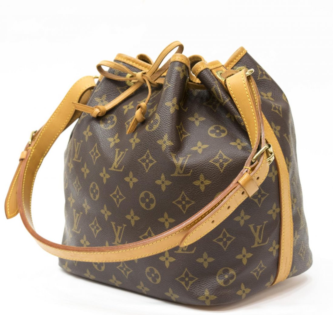 LOUIS VUITTON 'NOE PM' MONOGRAM CANVAS BUCKET BAG: Louis Vuitton "Noe PM" bucket shoulder bag in monogram canvas, having a leather adjustable strap, trim, and piping, the drawstring top opening to brown canvas lined interior, patination, spotting, and