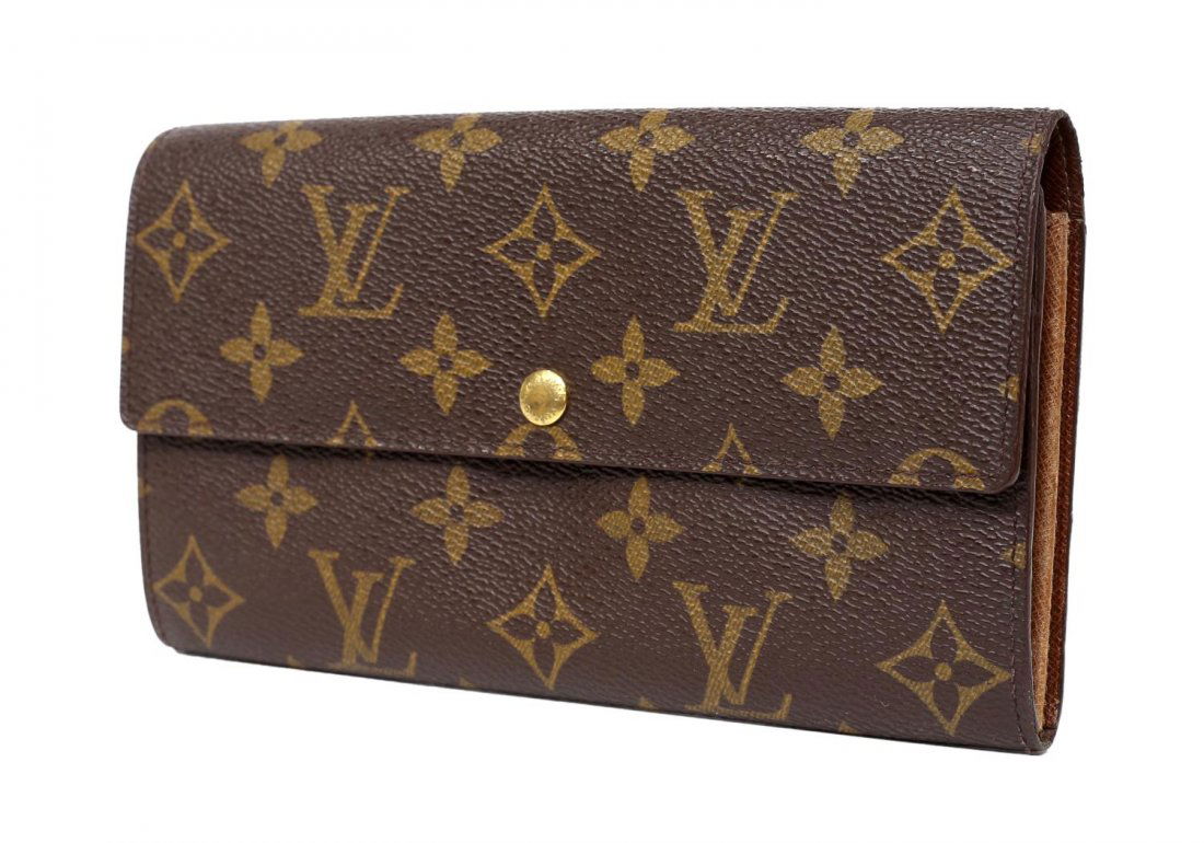 LOUIS VUITTON 'SARAH' MONOGRAM CANVAS WALLET: Louis Vuitton "Sarah" wallet in monogram canvas, single snap opening to two small slots, two interior compartments, center zippered storage, minor wear to interior, approx 4.25"h, 7.5"w, 0.5lb *Proven