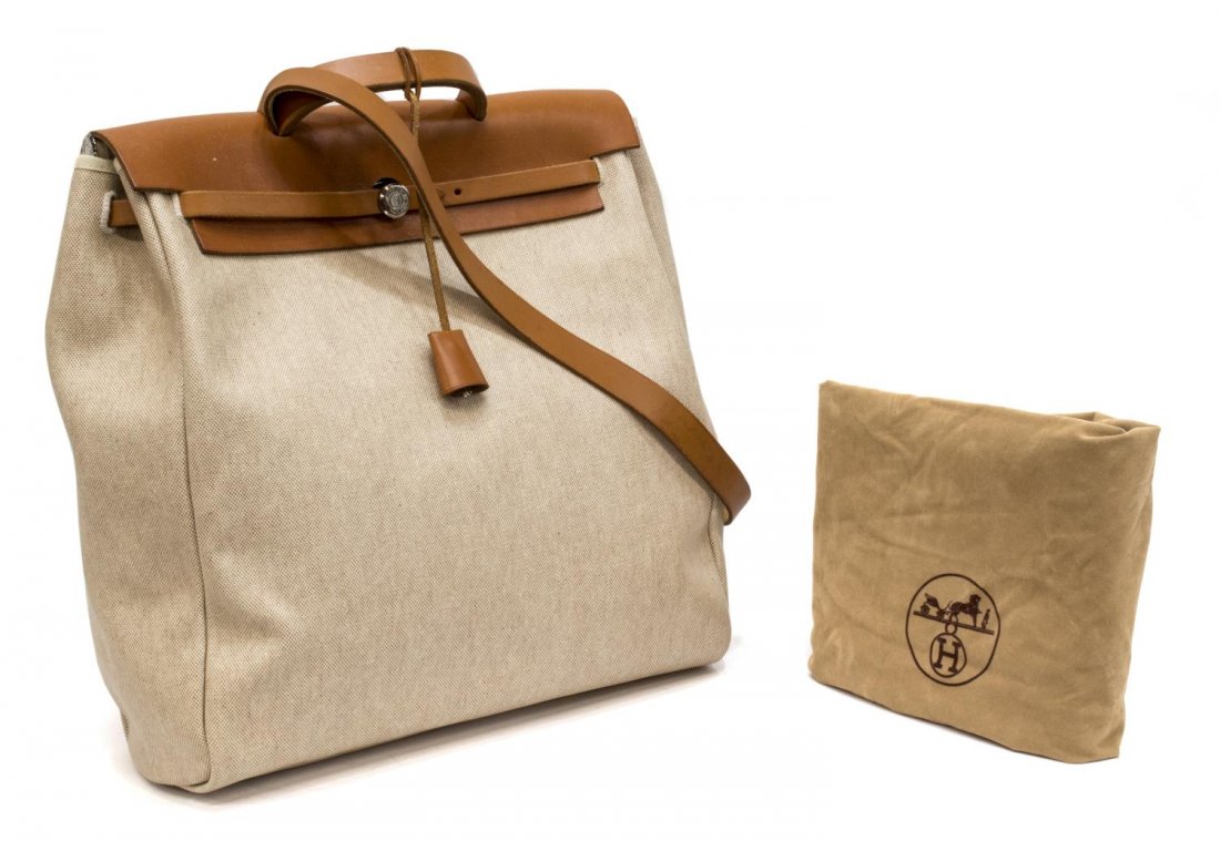HERMES 'HERBAG GM' CHANGABLE CANVAS SHOULDER BAG: Hermes changeable "Herbag GM" in two sizes, woven tan and white canvas with tan leather trim, pull through closure at top, includes dust bag, strap, leather tassel, keys and lock, large bag: 16"h, 14"