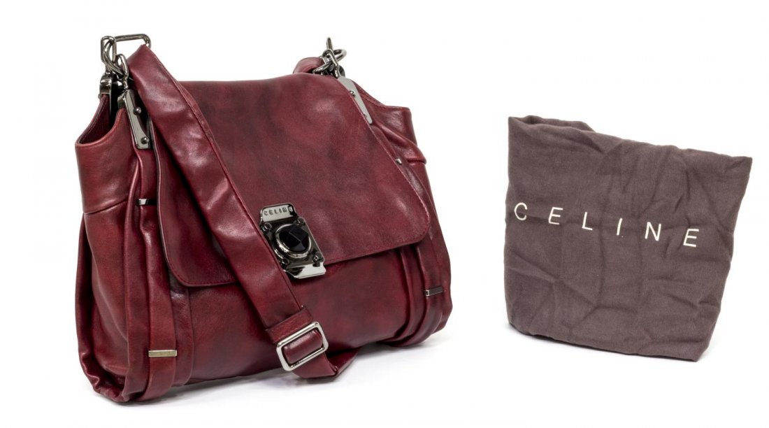 CELINE TONAL RED & BLACK LEATHER SHOULDER BAG: Celine tonal red and black leather shoulder bag, having dark hardware, flap top opens to gold lined interior with one zipper and two slot pockets, some picking to liner, no code found, surface wear to