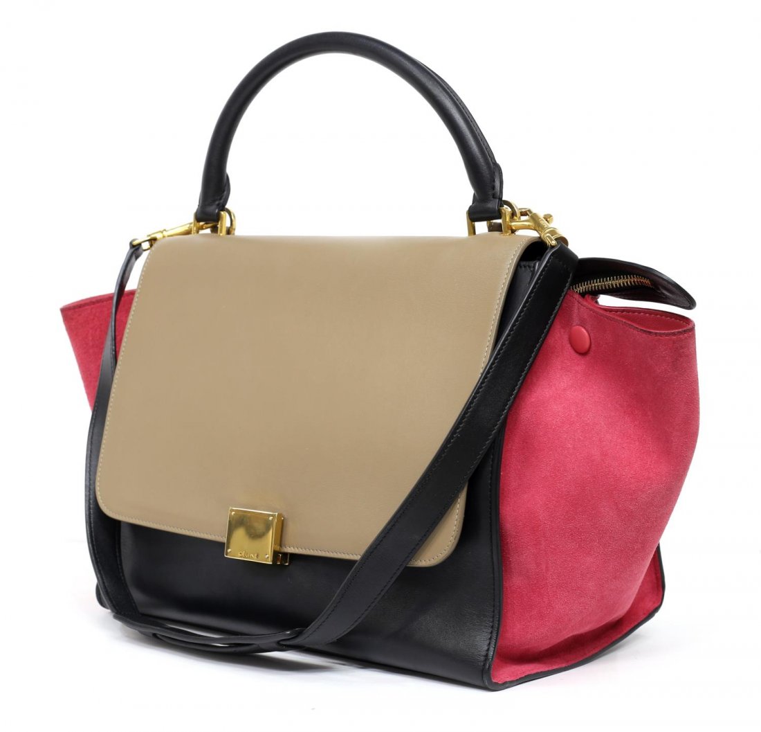 CELINE 'TRAPEZE' SUEDE & LEATHER HAND BAG: Celine "Trapeze" hand bag in pink suede and black and taupe leather, having gold tone hardware, single handle over flap top with folding closure, over zipper opening, tonal lined interior with hanging