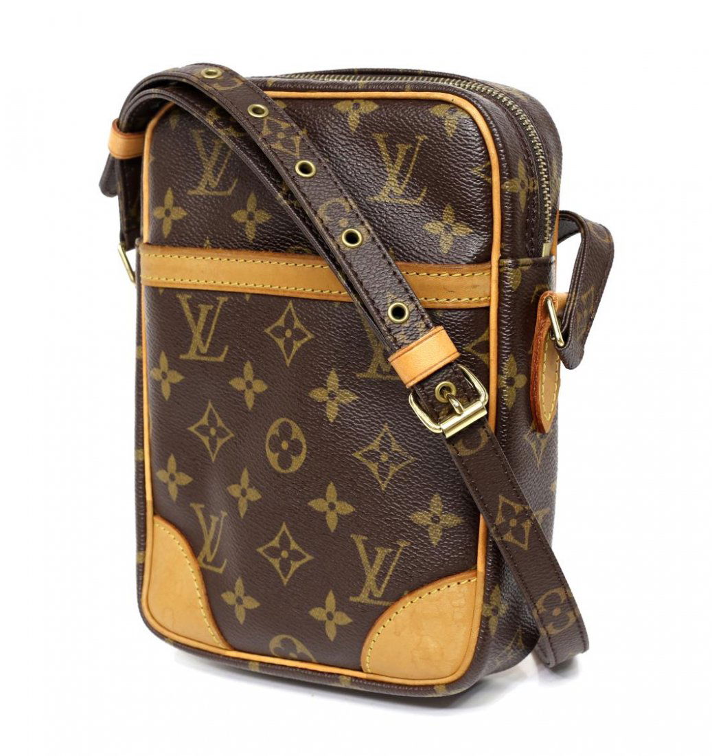 LOUIS VUITTON 'DANUBE' MONOGRAM SHOULDER BAG: Louis Vuitton "Danube" monogram canvas shoulder bag, exterior slip pocket, adjustable shoulder strap, gold tone hardware, top unzips to brown interior featuring a slot pocket, patination and spotting