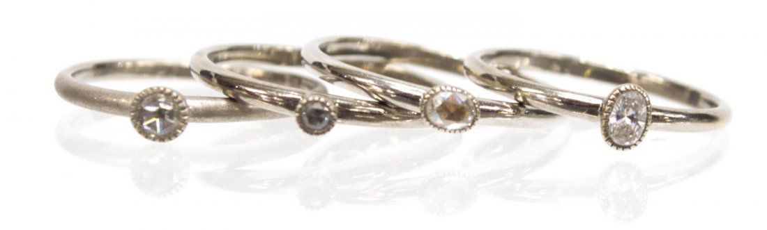 (4) LADIES STACKABLE 18KT W. GOLD & DIAMOND RINGS: (lot of 4) Ladies contemporary designer 18kt white gold and diamond stackable rings, comprising: (1) oval cut diamond, approx. 0.09ct; (1) oval rose cut diamond, approx. 3.3mm x 2.3mm; (1) round rose